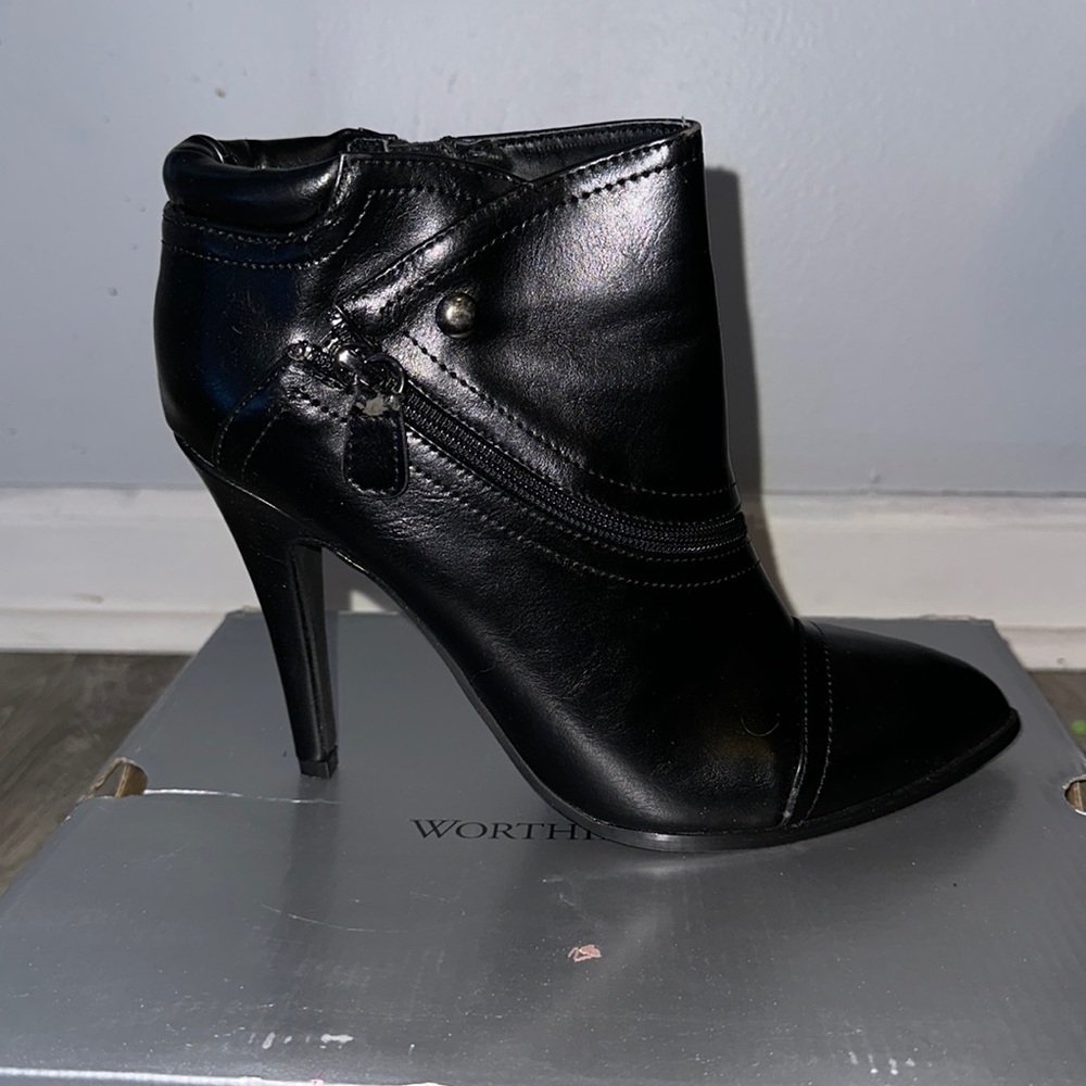 Black leather boots, still shiny.